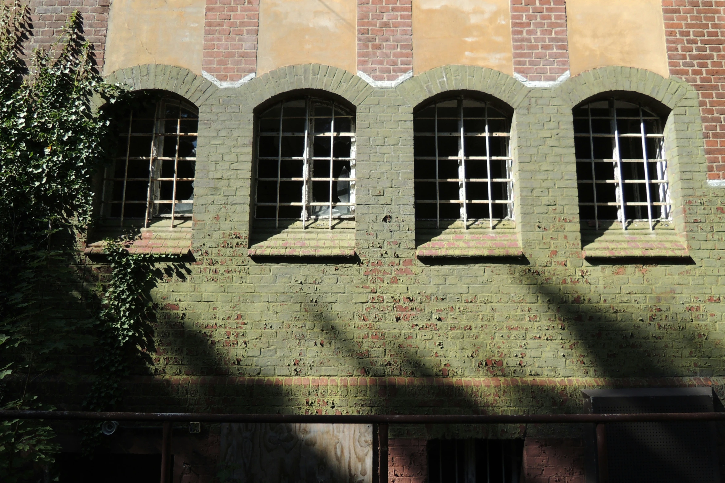 a po of a brick building with seven windows