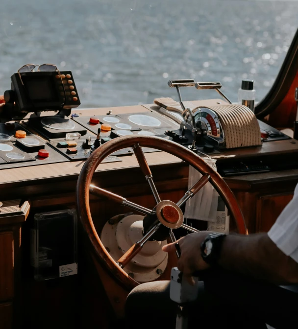 a steering wheel inside of a wooden boat