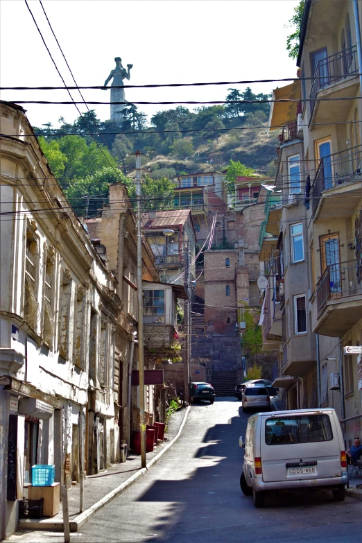 street with old buildings and a steep cliff