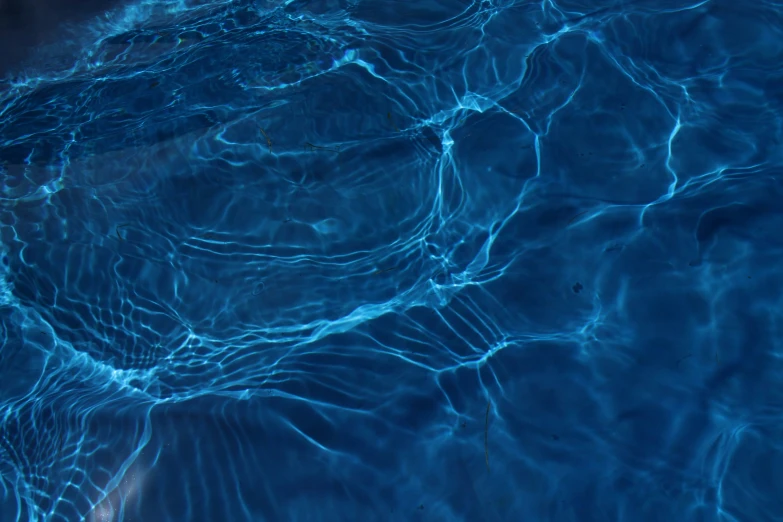 the inside of a pool has ripples and small waves
