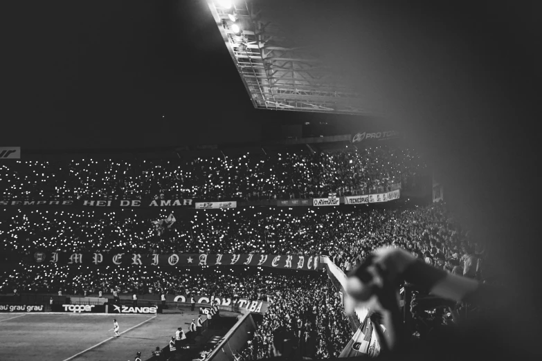 a stadium full of spectators at a tennis match