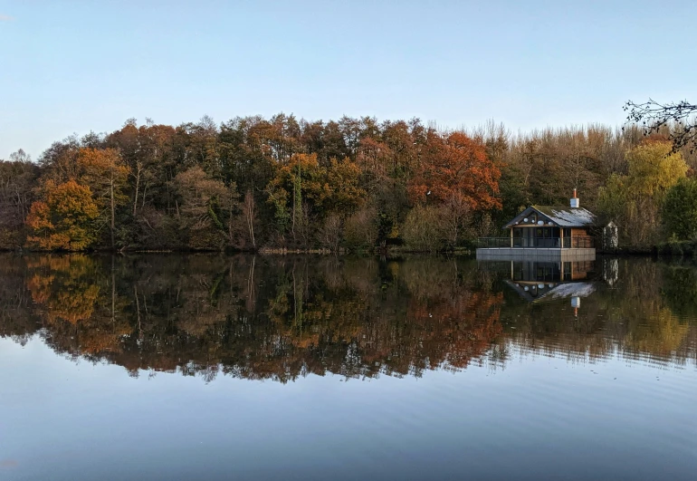 a cabin on the shore of a large body of water