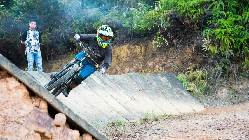 a man riding a bike on a ramp