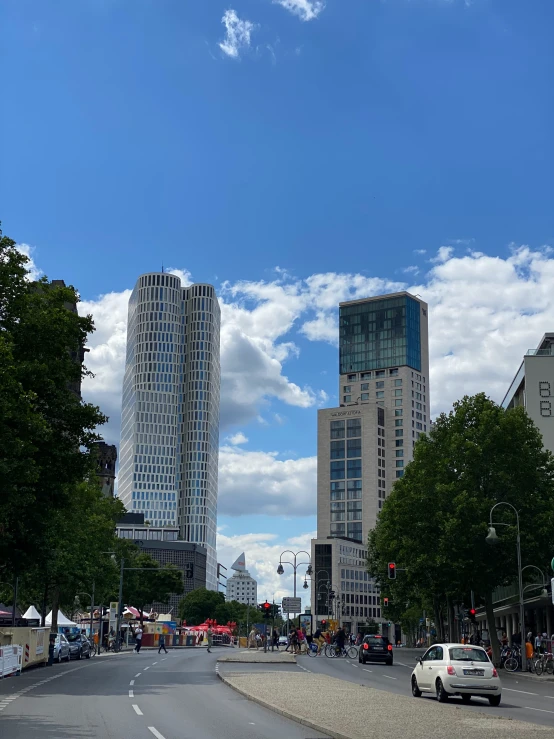 a street view with many cars going down it