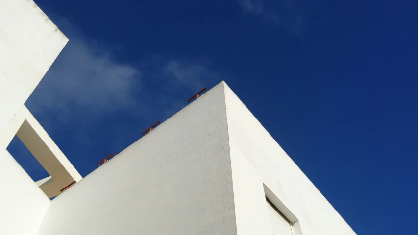 a closeup of a building with clear blue skies above