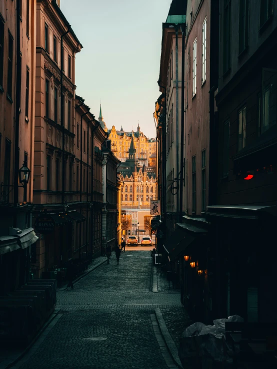 looking down an alleyway to an old castle like building