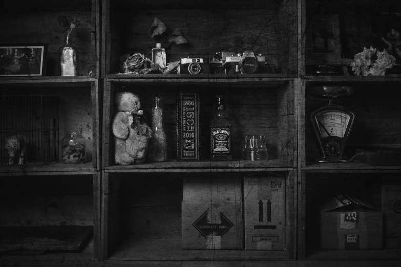 an old shelf filled with items in black and white