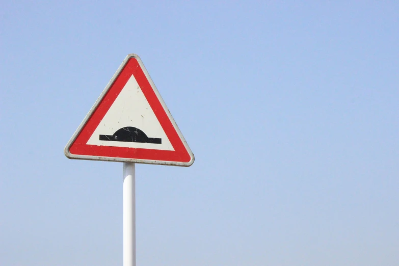 the sign shows that it's dangerous to cross a road