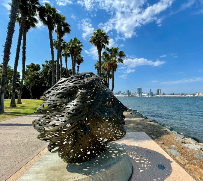 an art installation in a park next to the ocean