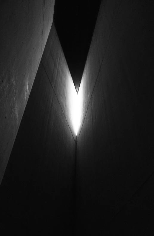 a black and white po of a corner with light