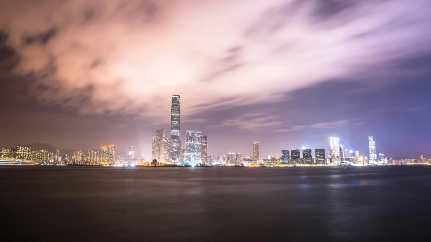 a city view with a cloudy sky at night