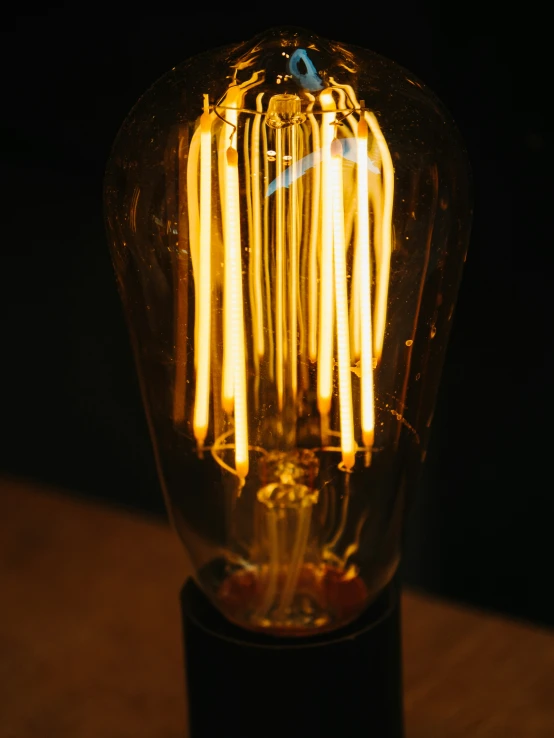 a vintage light bulb sitting on top of a wooden table