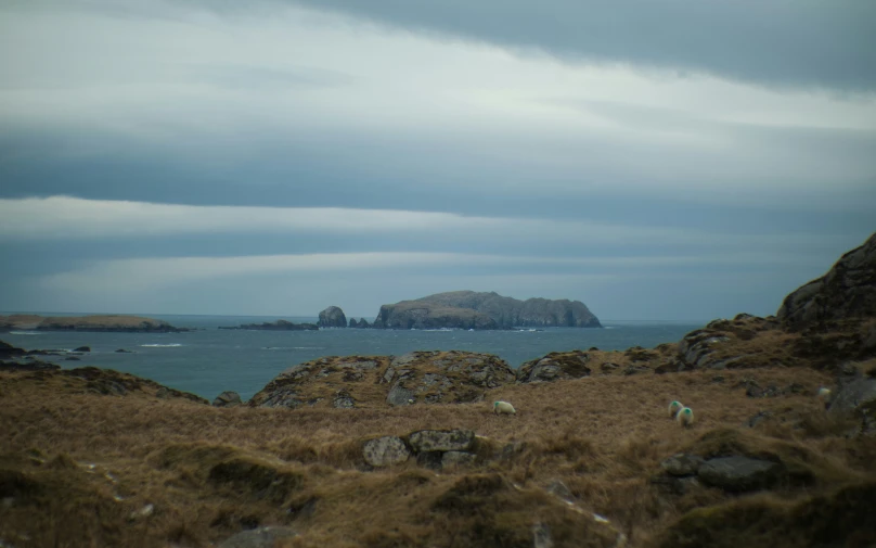 a rocky outcropping in the middle of water