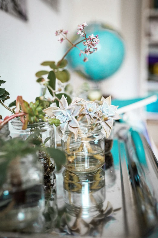 a glass jar filled with stars on a table