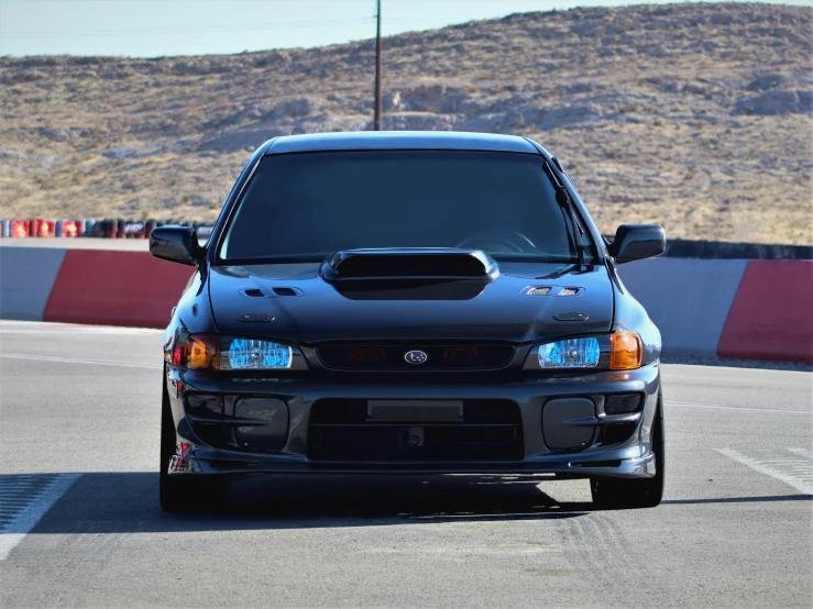 the front end of a silver subarued sport utility truck