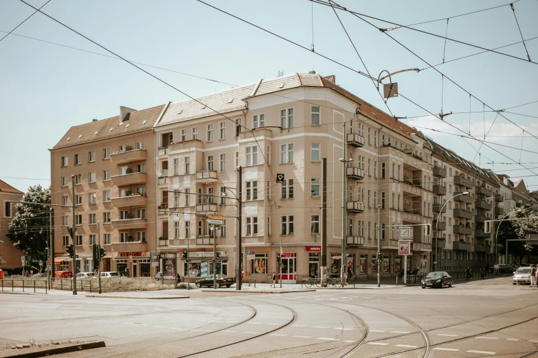 a train moving through a city with buildings and traffic lights