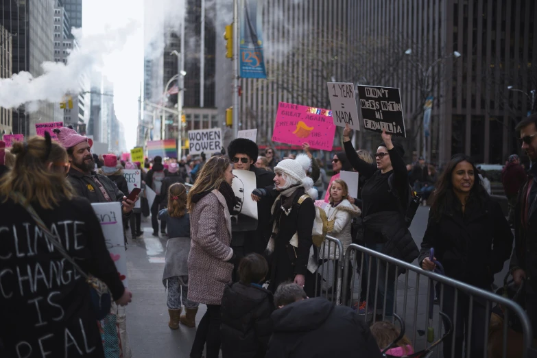 group of people on a city street protesting against climate change