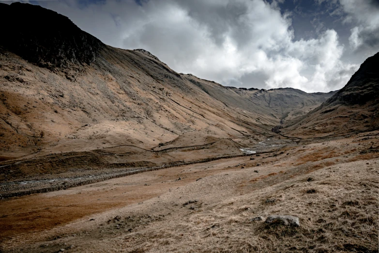 a very nice looking mountainous landscape with dirt