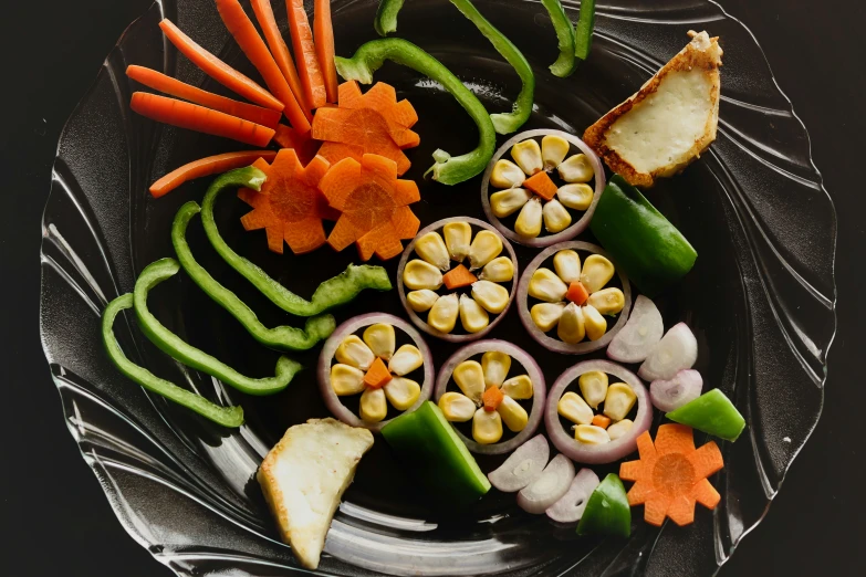 a plate is arranged with vegetables as a decoration
