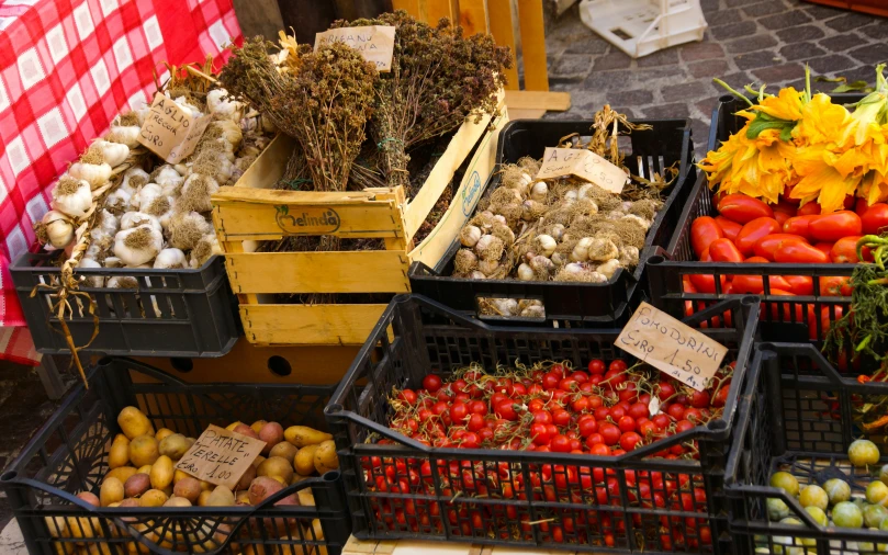 baskets of vegetables and fruit for sale on display in the market