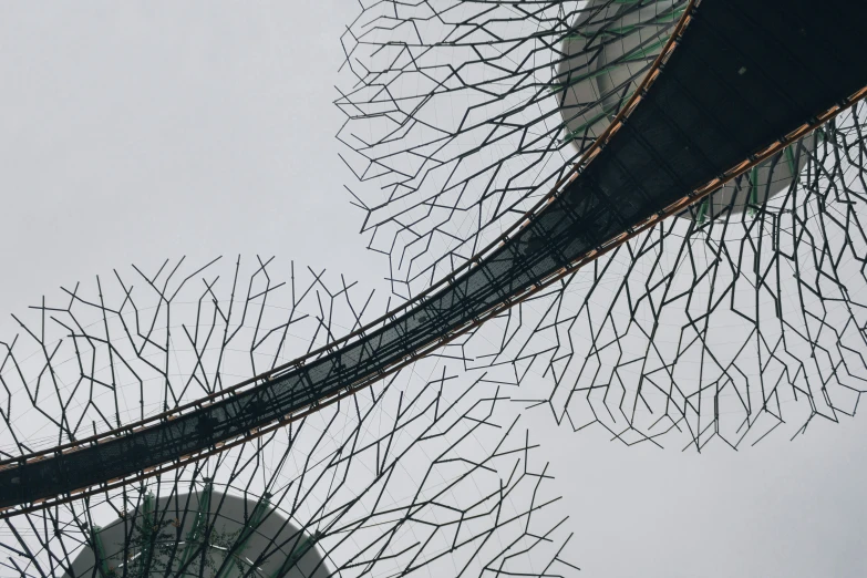 a large sculpture is in the center of a park