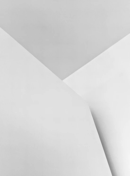two white sheets of paper with the one diagonal