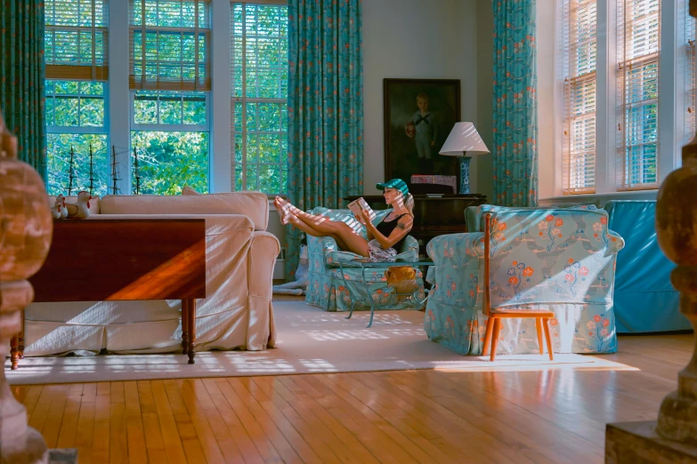 a person sitting in a chair in a living room