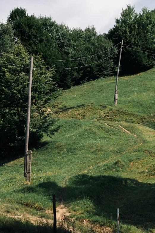 the hill is covered in green grass with no other vegetation