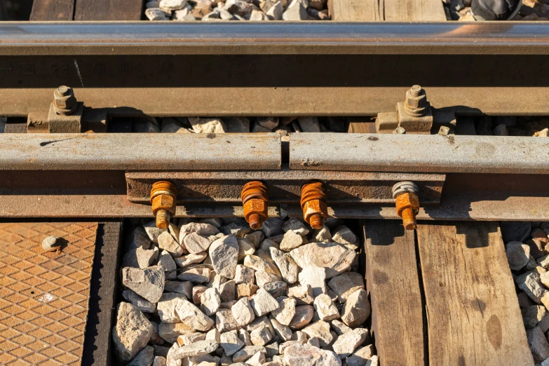 a bunch of rocks under an underpass with wires