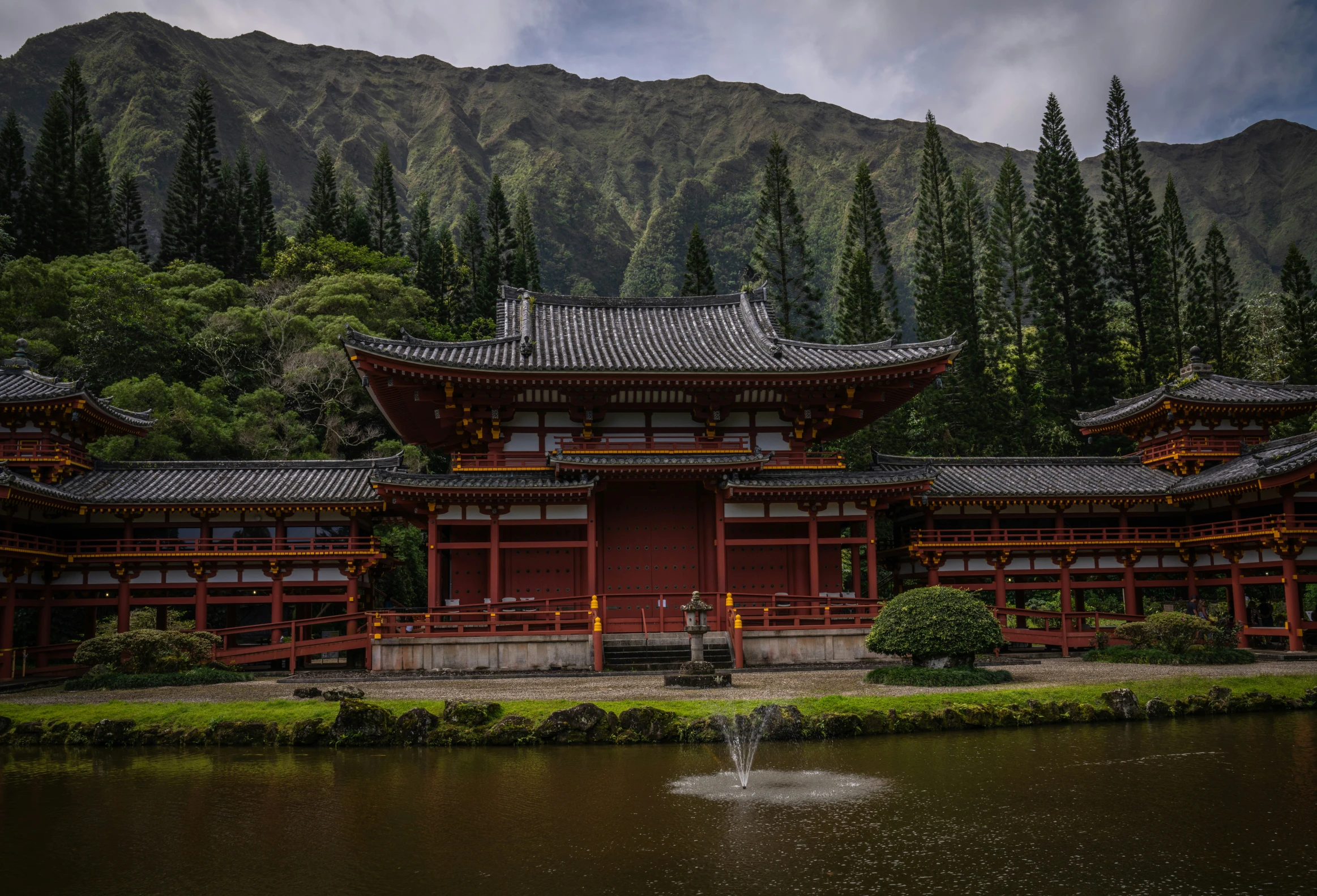 a pond that is surrounded by wooden buildings