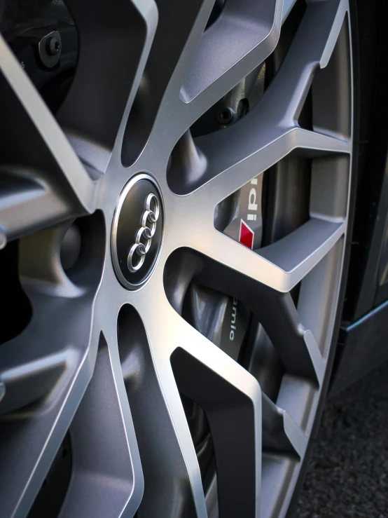 the wheel of a toyota vehicle with a red center mark on it