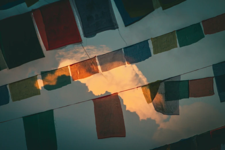 some colorful flags hanging in the air