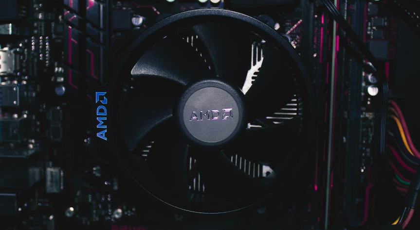 the fan in front of the computer is blue and purple