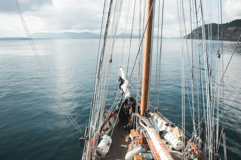 a sail boat in a body of water