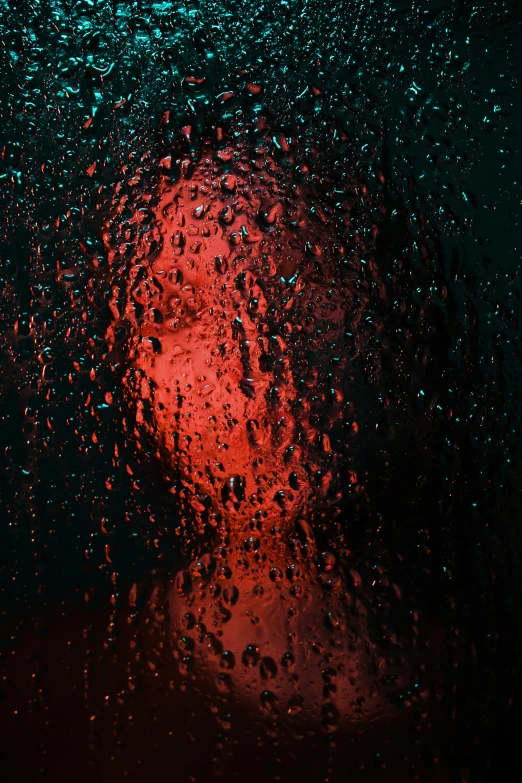 drops of rain on the glass, including an umbrella