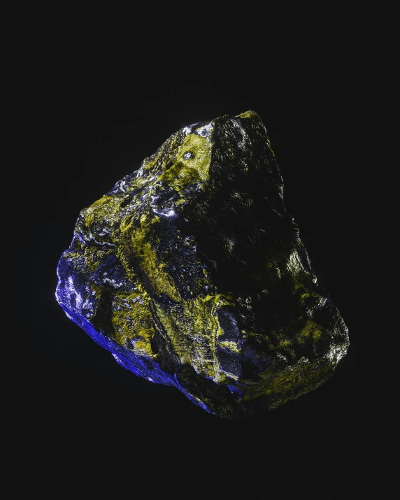 a glowing boulder that has many layers of bright, colorful materials