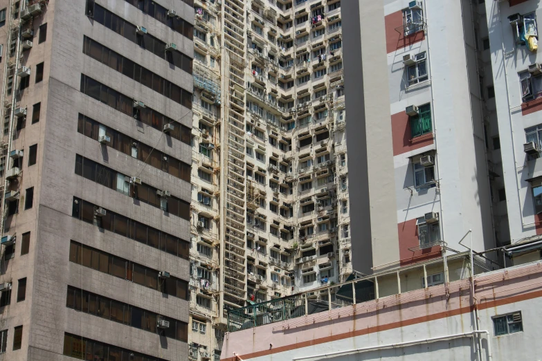 a couple of buildings with many balconies on the sides