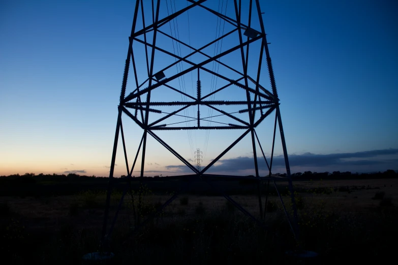 a tall structure that is surrounded by grass