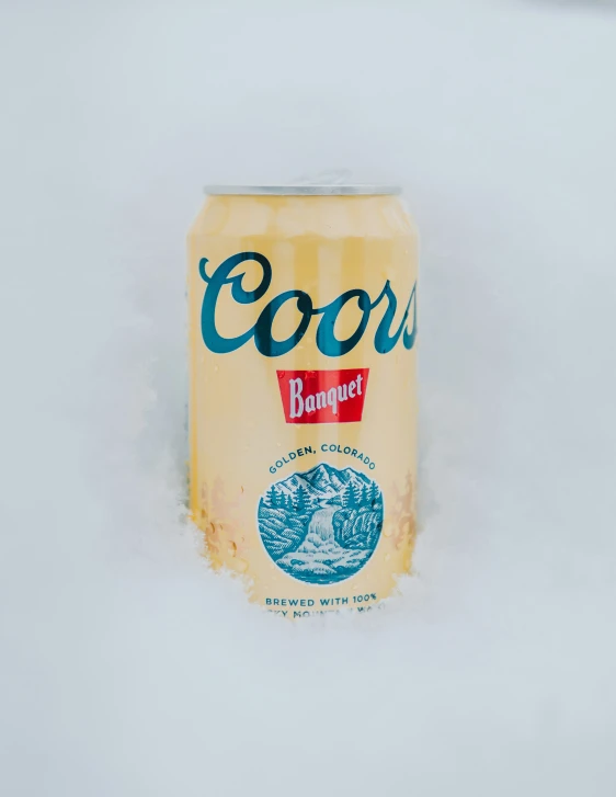 a canned can of coors beer in the snow