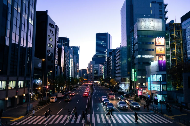 a city street filled with traffic at night