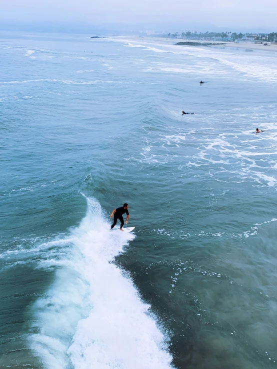 a person riding a surfboard in the ocean