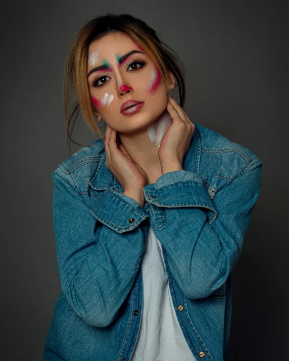 a beautiful young lady wearing some makeup