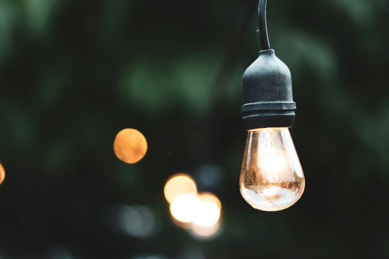 an image of a hanging light with some bulbs