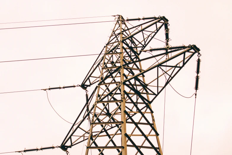 many cables and poles together on a white day