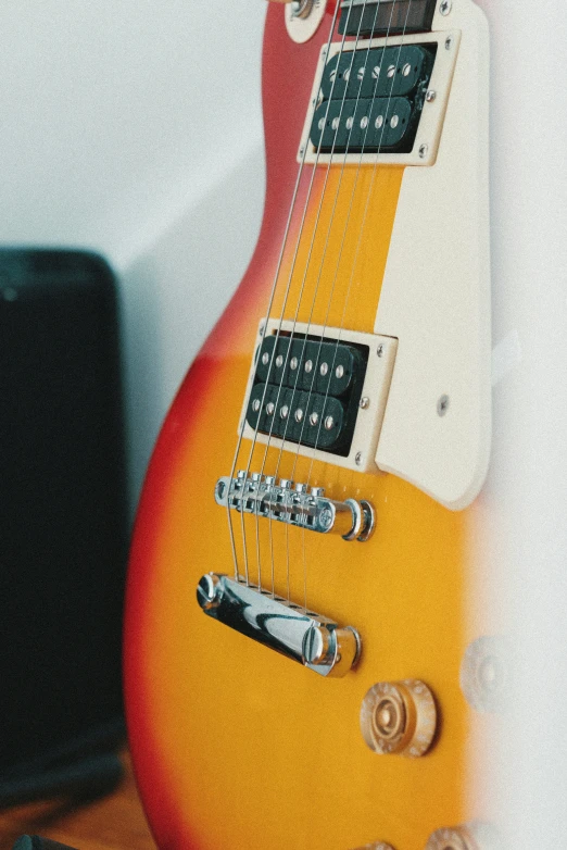 an electric guitar is shown on a desk