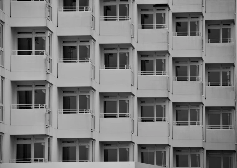 an apartment building with balconies and balconies windows