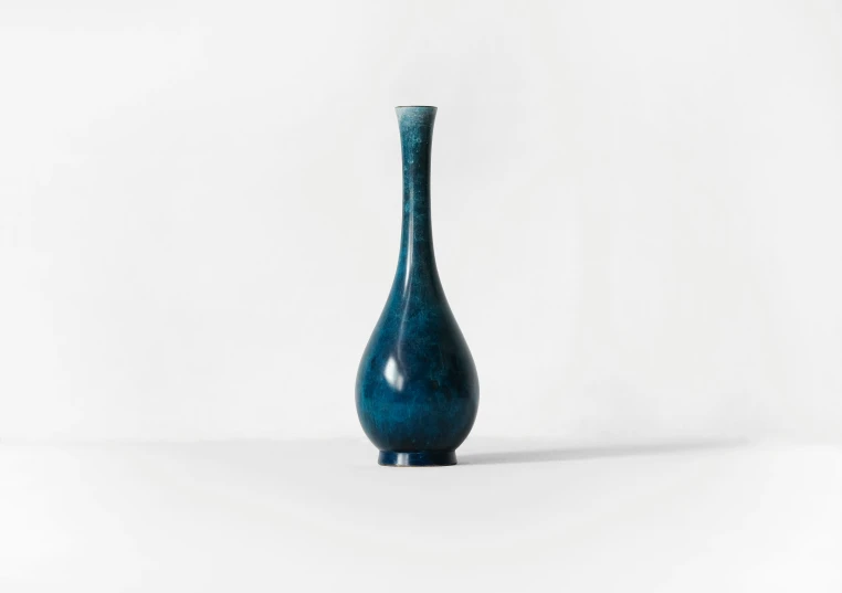 a vase with blue lust in the middle of it