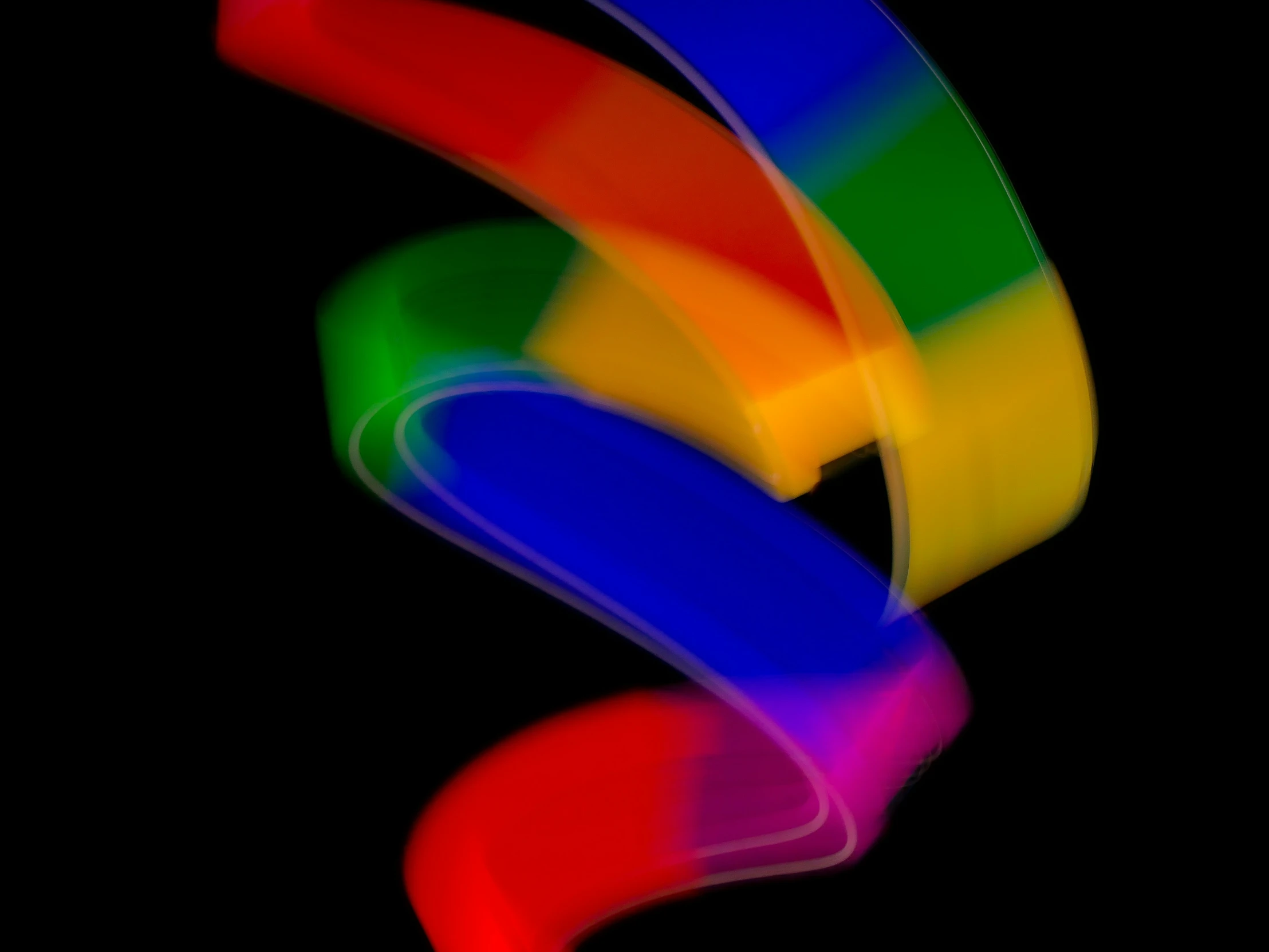 colorful spiral design of rainbow colors with black background