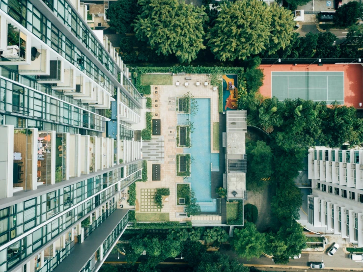 an overhead view of two buildings with balconies in front