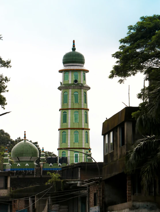 the tower of the building has a light blue dome on top